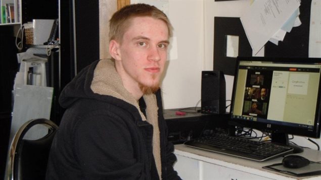 Pictured in 2015 Aaron Driver was killed in a confrontation with police Wednesday in the small Ontario town of Strathroy, near London. e see a young man dressed in a black jacket sitting in front of desk on which sits an open computer. He is looking at the camera under short, reddish-brown hair and a red, wispy goatee.