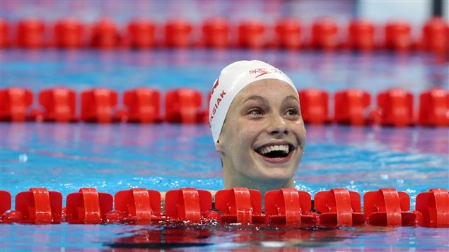 Canada’s Penny Oleksiak finally turned around to realize she had tied for Olympic gold in the 100-meter freestyle event. And she’s just a kid.