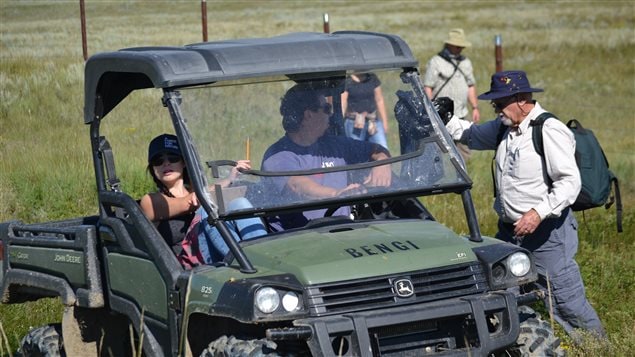 After collecting the cans, Nature Conservancy of Canada staff drove them around to cap fence posts.