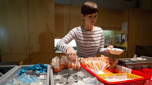 In this May 11, 2011 photo, registered nurse Sammy Mullally prepares supplies at the Insite safe injection clinic in the western city of Vancouver.