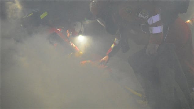 Mine rescue team competitors working in a real-life scenario of heat and smoke to rescue an injured miner. Unlike previous international competitions, this year’s event in Canada had several scenarios conducted deep in actual mines in Sudbury, Ontario.