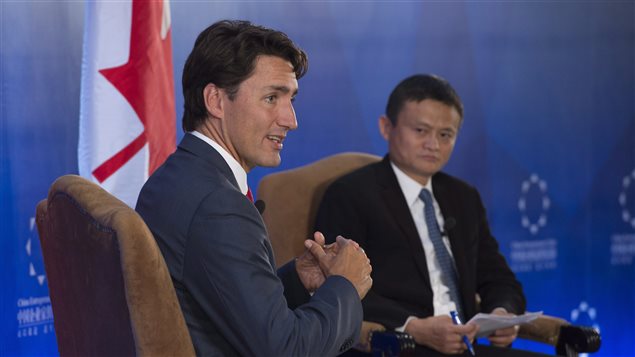 China Entrepreneur Club chairman Jack Ma (right) listens to Canadian Prime Minister Justin Trudeau respond during a question and answer session in Beijing, China Tuesday August 30, 2016.