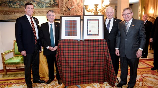 February 2016 and unveiling of new Hill 70 Tartan (framed). From L-R, Mark Hutchings, Nicholas Chapuis (Ambassador of France to Canada), His Excellency the Governor-General of Canada, David Johnson, and Mr Jim Reid.