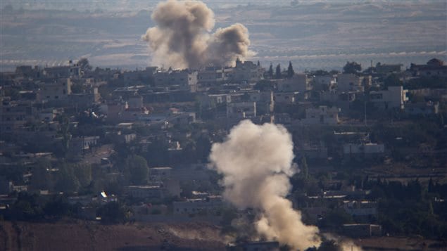 Explosions send smoke into the air over Jubata al-Khashab, Syria the day before the ceasefire took effect.