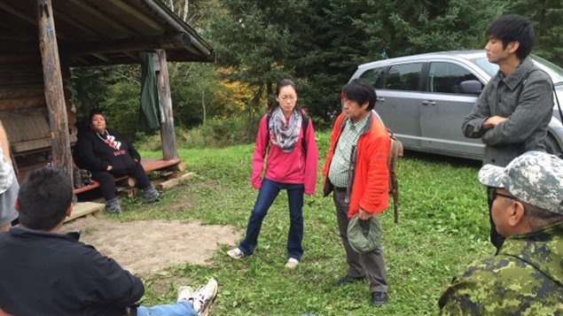 Dr. Masanori Hanada, centre, delivers the results of his study on mercury poisoning to people at Grassy Narrows First Nation.