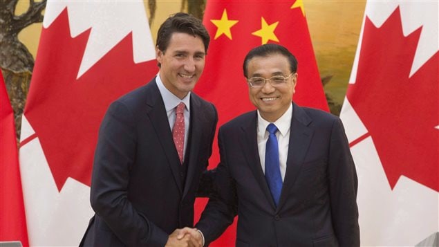 Prime Minister Justin Trudeau shakes hands with Chinese Premier Li Keqiang in Beijing on August 31, 2016. Canada must balance its values against a desire for more trade with China.