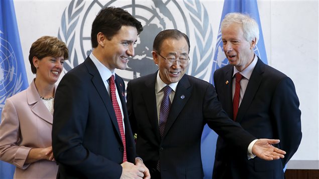  United Nations Secretary General Ban Ki-moon (3rd L) directs Canadian Prime Minster Justin Trudeau (2nd L) to a seat while Canadian Minister of International Development Marie-Claude Bibeau (L) and Canadian Minister of Foreign Affairs Stephane Dion (R) look on during a photo opportunity at United Nations Headquarters in the Manhattan borough of New York, March 16, 2016.