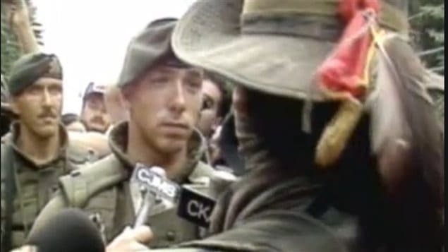 Sept 1, 1990 A Mohawk ’warrior* Ronald *lasagna* Cross, involved in a stare-down with a Canadian solider of the Royal 22e Regiment. The incident lasted only several seconds, Cross later telling reporters, **I just wanna look at their faces before I kill ’em.*