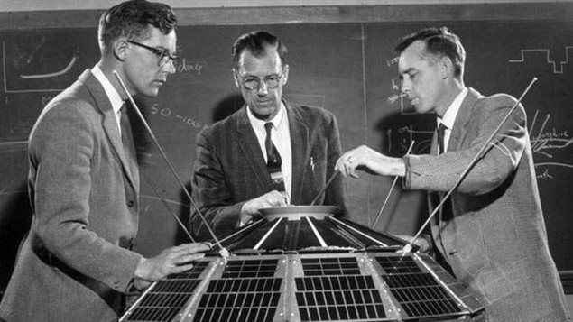 Dr. Colin Franklin, Keith Brown and Dr. John Barry (left to right) with the Alouette- 1 satellite in April, 1961.