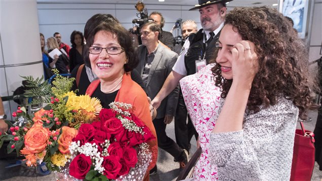  Homa Hoodfar, left, and her niece, Amanda Ghahremani, are greeted by friends and supporters as they arrive at Trudeau Airport Thursday, September 29, 2016 in Montreal. Hoodfar, a Canadian-Iranian academic was held in Iran’s Evin prison for more than 100 days. 