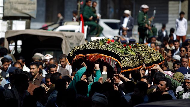 Yemeni mourners carry the coffin of Abdel Qader Hilal, the mayor of the capital Sanaa, on October 10, 2016 after he was killed in an air strike on a funeral in the Yemeni capital three days ago. 