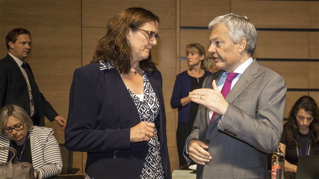 European Commissioner for Trade Cecilia Malmstrom, left, speaks with Belgian Foreign Minister Didier Reynders during a meeting of EU trade ministers at the EU Council building in Luxembourg, Tuesday, Oct. 18, 2016. 