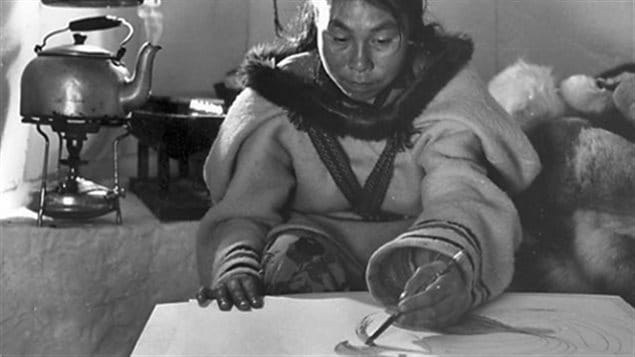 Photo from the National Film Board documentary on Ashevak showing her working and living in the traditional nomadic lifestyle in 1962, a few years before she and family moved into the community of Cape Dorset where she became a prolific and groundbreaking artist.