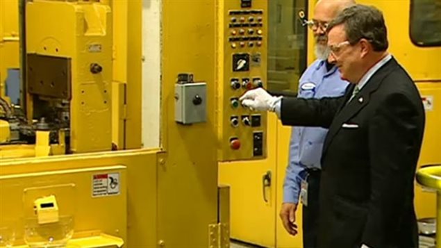 The then Conservative government Finance Minister,(the late) Jim Flaherty about to press the button to stamp the last Canadian pennies in May 2012. Will a similar photo-op take place soon for the Canadian 5-cent coin?
