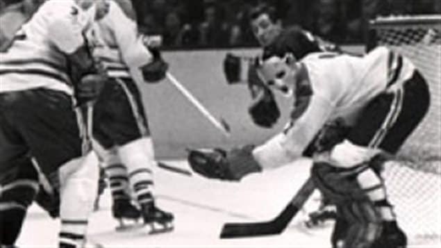 Plante in action wearing a protective mask 1959 , breaking boundaries in hockey and making it safer. At first ridiculed, other goalies soon adopted masks themselves