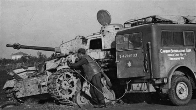 CBC reporter at the front in WWII with the specialized 8cwt Canadian designed Heavy Utility truck recording vehicle.