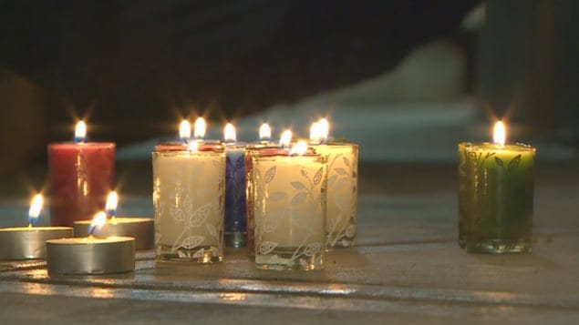 Students and parents left candles in memory of the student who was killed at a high school in the western city of Abbotsford.