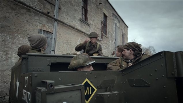 The film uses accurate re-enactments including proper period Canadian P-37 uniforms and webbing, and Canadian designed and builr vehilcles like this small tracked, universal carrier (aka bren-gun carrier)