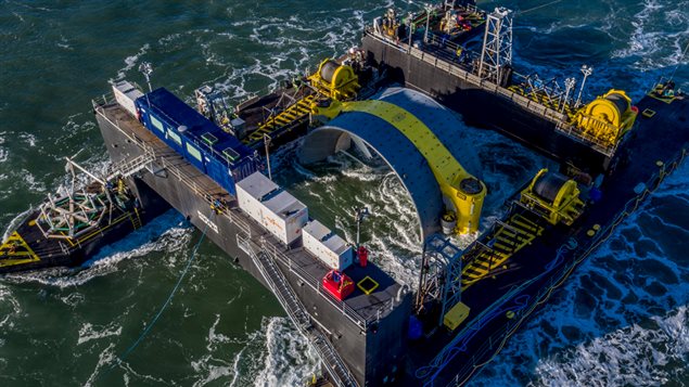 The Scotia Tide deployment barge is towed into position in the Minas Passage near Parrsboro, Nova Scotia on Monday Nov. 7, 2016 in this handout image provided by Cape Sharp Tidal. Cape Sharp Tidal had planned to install it over the weekend, but had to put it off while preparation work was being done on the turbine’s tail 
