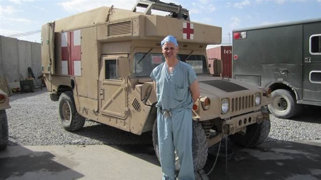 Maj. Andrew Beckett, beside a humvee ambulance, Kandahar Role 3 Hospital, Afghanistan 2010