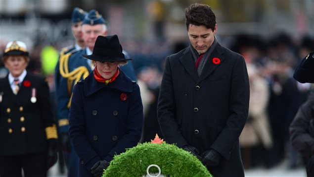 Prime Minister Justin Trudeau and wife Sophie Gregoire-Trudeau place a wreath during a Remembrance Day ceremony at the National War Memorial in Ottawa on Friday, Nov. 11, 2016. 