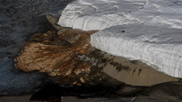 Soil is exposed by the Taylor Glacier in Antarctica on Nov. 12, 2016. Visiting U.S. Secretary of State John Kerry said citizens who care about limiting greenhouse gas emissions might have to march in the streets.