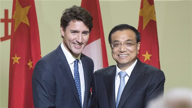 Chinese Premier Li Keqiang, and Canadian Prime Minister Justin Trudeau shake hands after speaking to a business luncheon Friday, September 23, 2016 in Montreal.