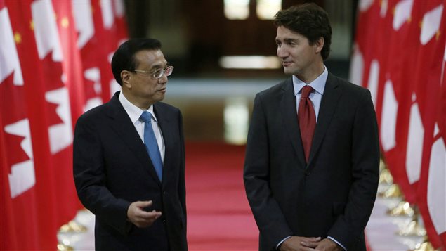 Chinese Premier Li Keqiang and Canadian Prime Minister Justin Trudeau(left to right) stand in the Hall of Honour as they take part in a signing ceremony on Parliament Hill in Ottawa on Thursday, September 22, 2016.