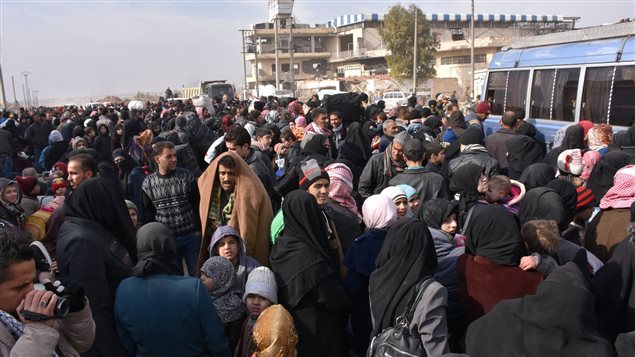 Evacuación de civiles sirios de los distritos del este de Alepo. 