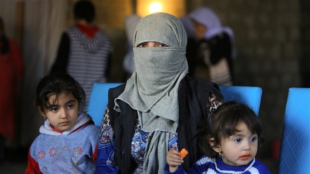 A displaced woman and children from the minority Yazidi sect, who were kidnapped by Islamic State militants of Tal Afar but managed to escape, are seen at a house in Duhok province, northern Iraq, November 24, 2016.