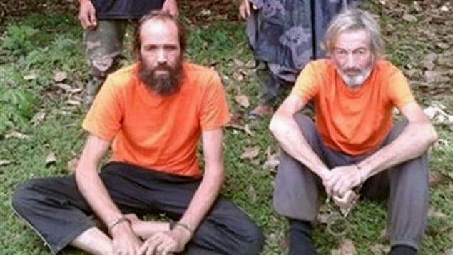Hostages Canadian national Robert Hall (R) and Norwegian national Kjartan Sekkingstad (L) are seen in this undated picture released to local media, in Jolo island in southern Philippines.
