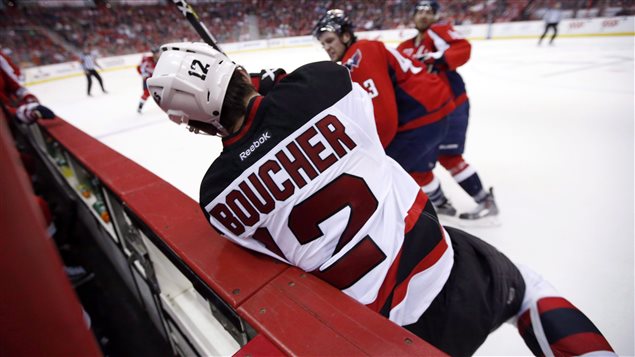 New Jersey Devils Reid Boucher is knocked into the boards on March 26, 2015. This kind of hit happens often and can cause a concussion.