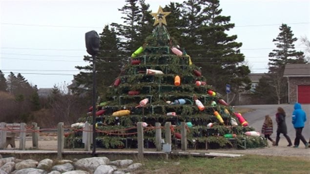 The lobster traps are piled into a pyramid shape and filled with tree branches and light, but in recent years with a much more significant decoration