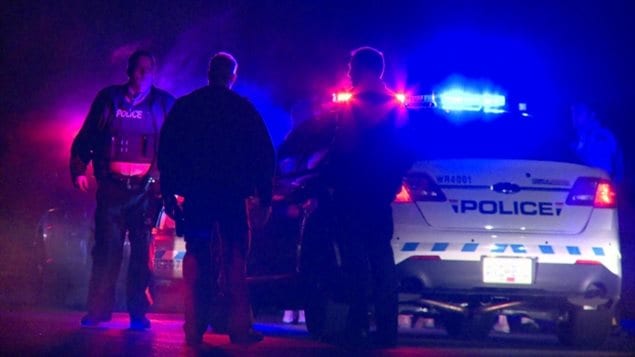 RCMP officers respond to a call following an attack on a home in Surrey, B.C. in January. 