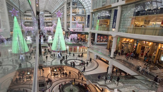 Canadians say they will spend less on Christmas shopping this year, but about half won’t stick to the plan.