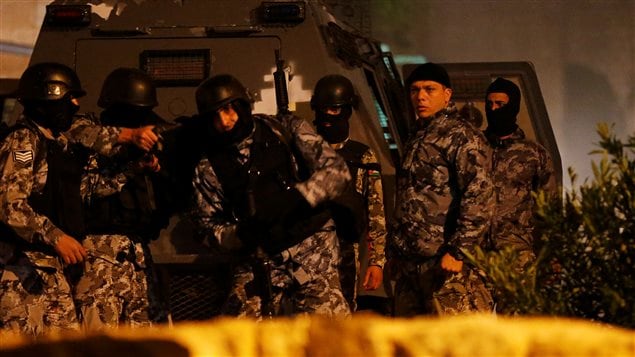 Jordanian policemen operate in the vicinity of Karak Castle, where armed gunmen carried out an attack, in the city of Karak, Jordan, December 18, 2016.