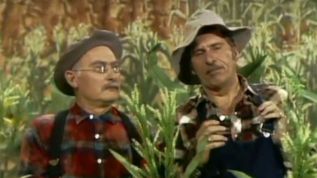 Gordie Tapp (R) with Grandpa Jones telling jokes in the *corn patch* on the country music, variety, and comedy show Hee Haw