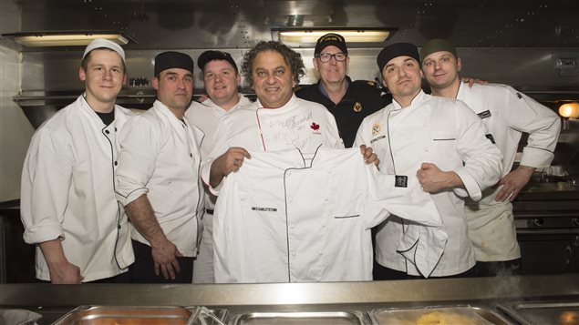 Celebrity chef, Vikram Vij (center) and the cooks onboard Her Majesty’s Canadian Ship (HMCS) CHARLOTTETOWN pose for a photo after preparing supper for the ship’s crew during Operation REASSURANCE, December 17, 2016.