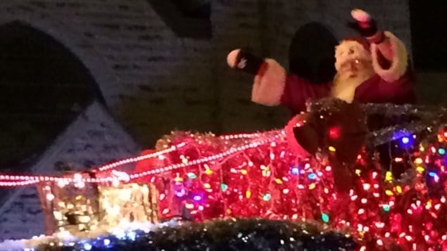 Santa, with sleigh and reindeer, taking part in one of the many pre-Christmas parades in Canada, this one in Winnipeg in November