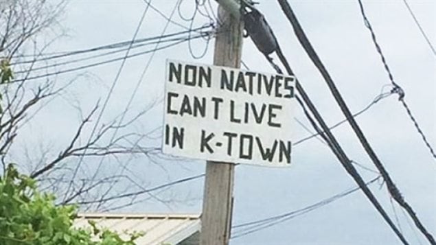 This sign is posted on a telephone pole in Kahnawake.