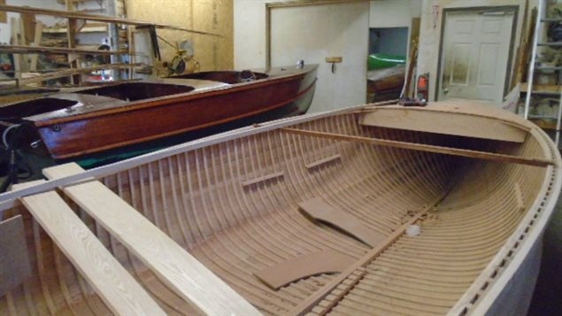 A beautiful boat nearing completion in the back, and another model with a ways to go yet in teh foreground.