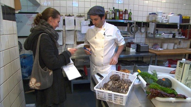 Lysiane delivering to a local restaurant where she will also pick up the coffee dregs. The chefs appreciate the freshness of the local product.