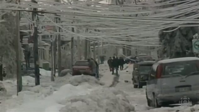 Jan 1998 Montreal streets blocked with ice-covered snow banks frozen solid, with heavily laden power lines drooping and breaking, along with thousands of broken branches littering the streets