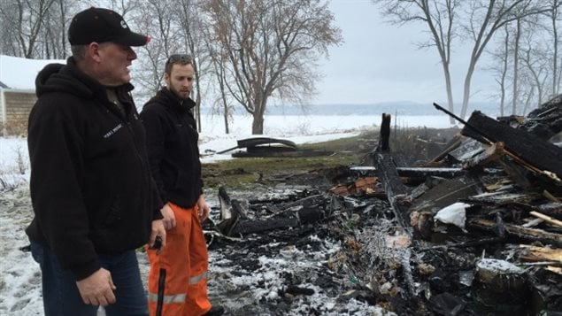 “We are not heroes,” said Mario Ménard, left, after he and a colleague rescued three from their burning house.