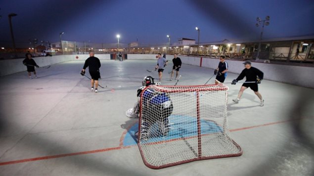 Two teams of Canadian soldiers play an improvised hockey matchunder the lights at Kandahar Airfield in Afghanistan on Thursday, Nov. 18, 2010. 