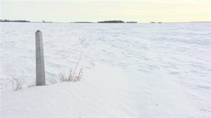 Hundreds of people have been crossing the U.S.-border illegally near this border in Emerson, Man., this winter, seeking asylum in Canada. The marker signifies the start of the U.S. border. Across the field is North Dakota. 