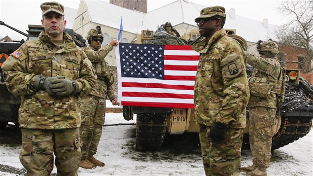 U.S. Army soldiers are welcomed in Poland as part of the requested NATO force. European leaders worry U.S. participation in the alliance may change after Donald Trump is sworn in as president.