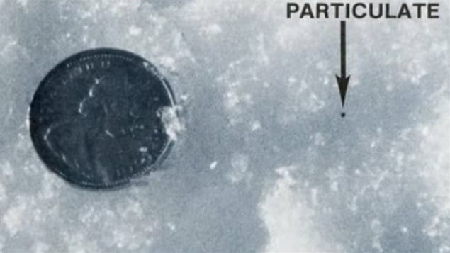 Many of the thousands of bits of radioactive material recovered were tiny even to the size of a grain of salt, shown here compared to a Canadian coin