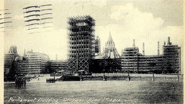 Scaffolding covers the exterior walls in June 1916. They are not being restored here, rather they are being taken down.