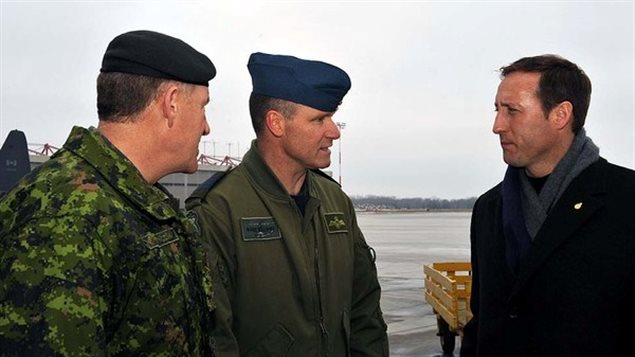 Already a murderer, Col. Russell Williams, centre, commander of CFB Trenton, with Defence Minister Peter MacKay, right, and Gen. Walter Natynczyk, chief of the defence staff, in Trenton on Jan. 17, 2010